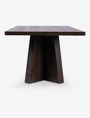 Side view of the Hallen angular leg sculptural dining table.