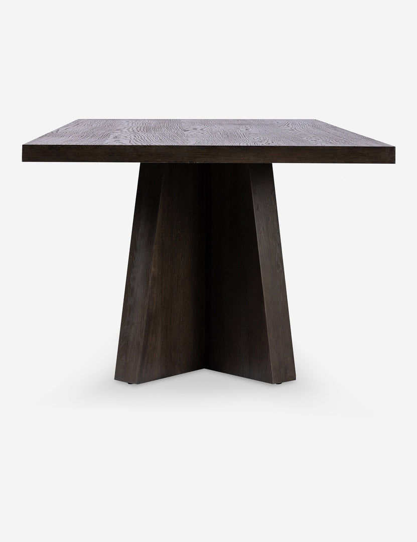 #color::brown | Side view of the Hallen angular leg sculptural dining table.