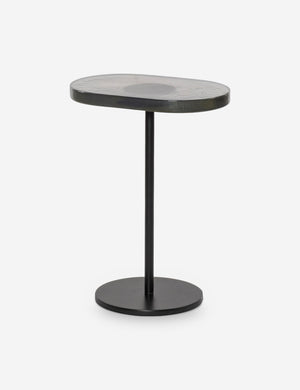 Angled view of the Ario slim iron glass top side table.