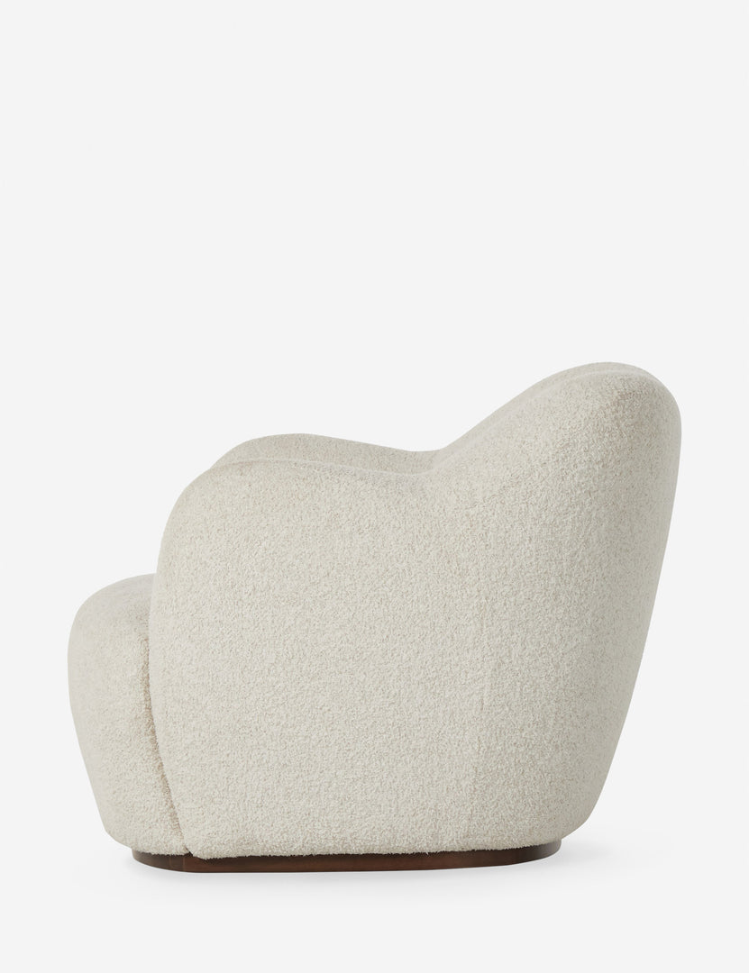 #color::ivory-boucle | Side profile of the Selkie modern barrel swivel chair in ivory boucle.