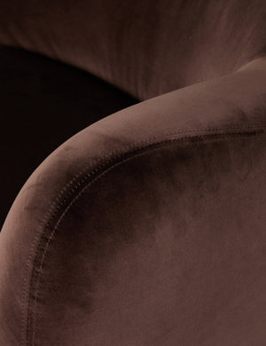 Close up of the fabric texture of the Selkie modern barrel swivel chair in brown velvet.