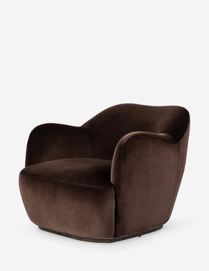 Angled view of the Selkie modern barrel swivel chair in brown velvet.