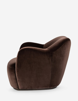 Side profile of the Selkie modern barrel swivel chair in brown velvet.