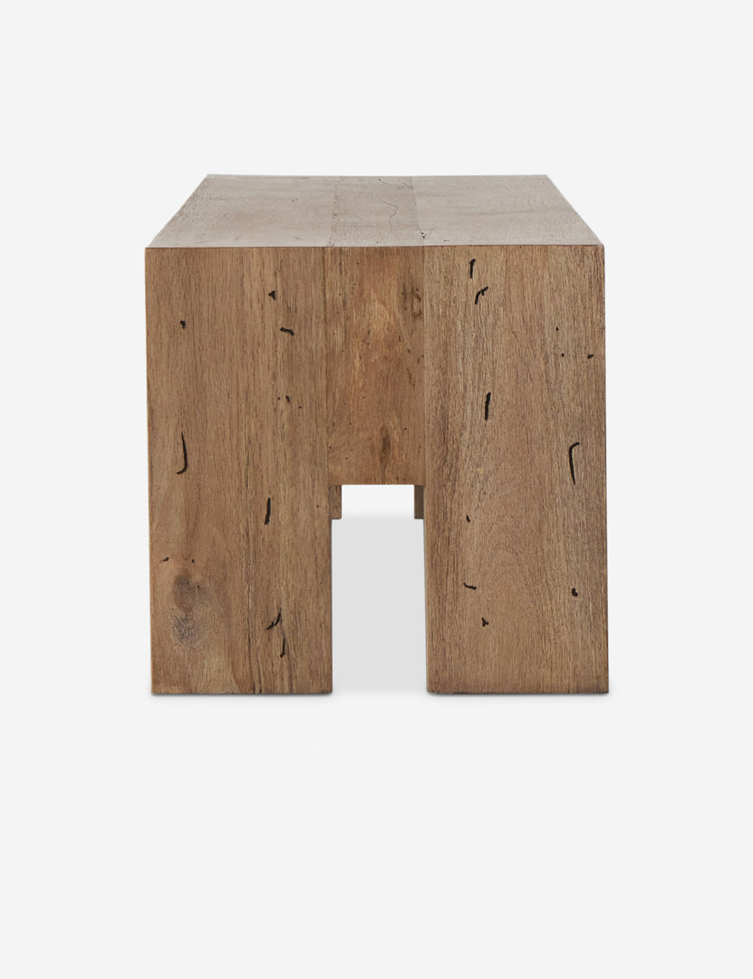 #color::natural | Side view of the Bevan chunky leg distressed wood bench in natural.