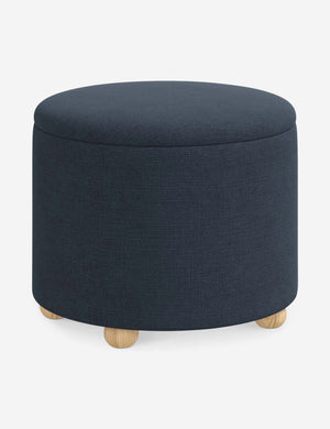 Angled view of the Kamila Navy Linen 24-inch ottoman