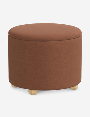 Angled view of the Kamila Terracotta Linen 24-inch ottoman