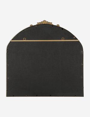 Rear view of the Tulca arched gold mirror with flat bottom edge and traditional scroll detailing.