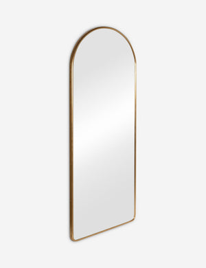 Angled view of the Shashenka gold arched floor mirror