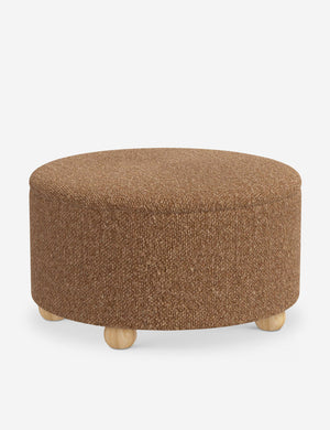 The storage space inside the Kamila Brown Boucle 34-inch ottoman