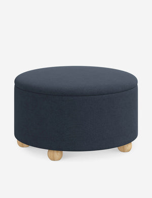 Angled view of the Kamila Navy Linen 34-inch ottoman