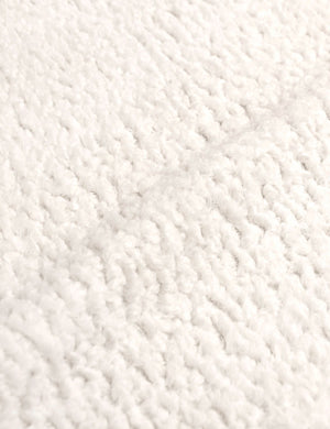 Detailed shot of the boucle fabric on the Adara cream sherpa upholstered bed.