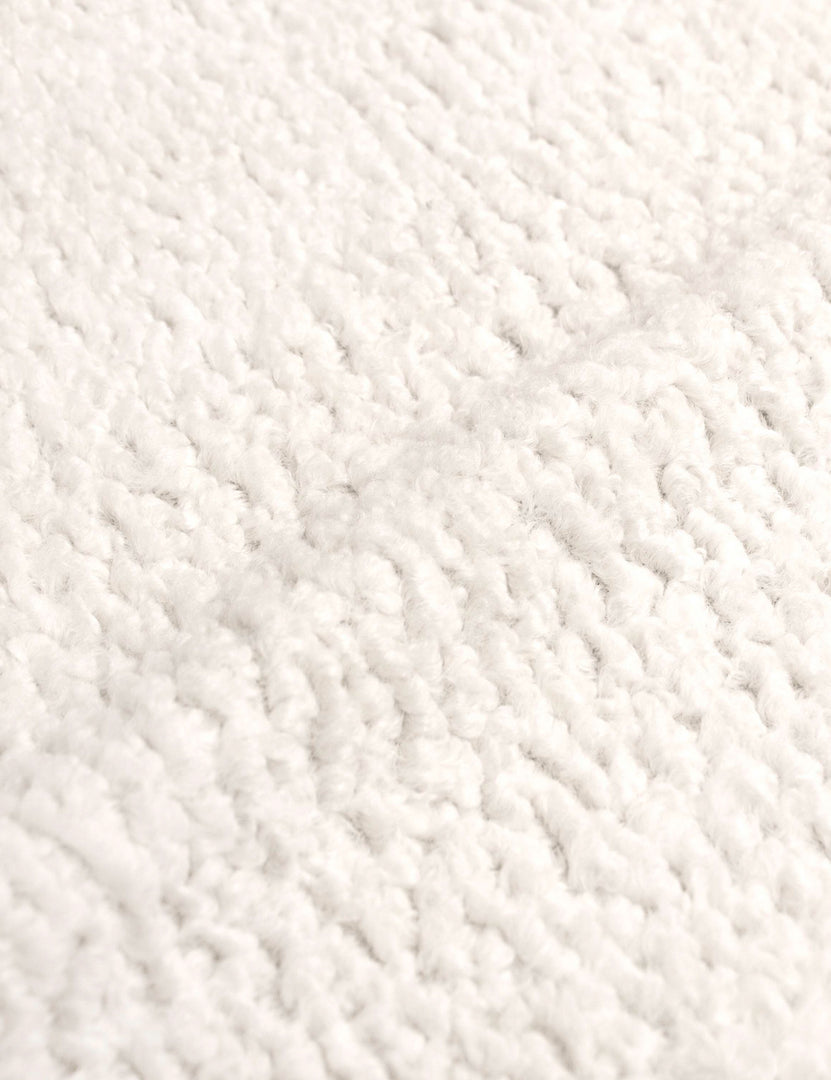 #color::cream-sherpa #size::cal-king #size::full #size::king #size::queen #size::twin | Detailed shot of the boucle fabric on the Adara cream sherpa upholstered bed.