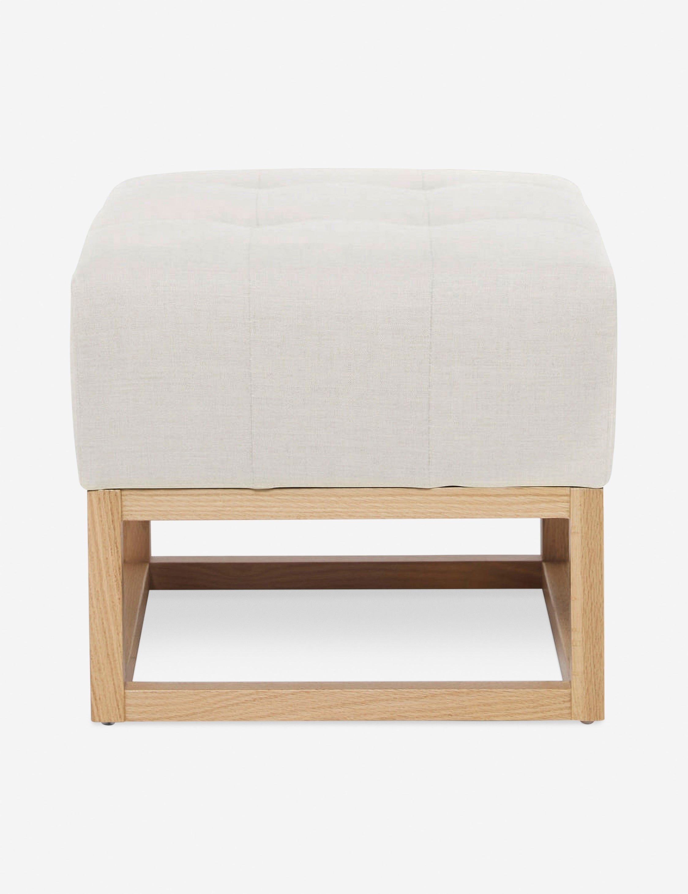 #color::oyster | Oyster White Linen Grasmere Ottoman with an upholstered cushion and airy wooden frame by Ginny Macdonald
