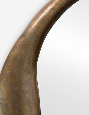 Close-up of the inorganic frame design on the Doreen brass organic round mirror