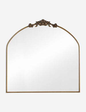 Tulca arched gold mirror with flat bottom edge and traditional scroll detailing.