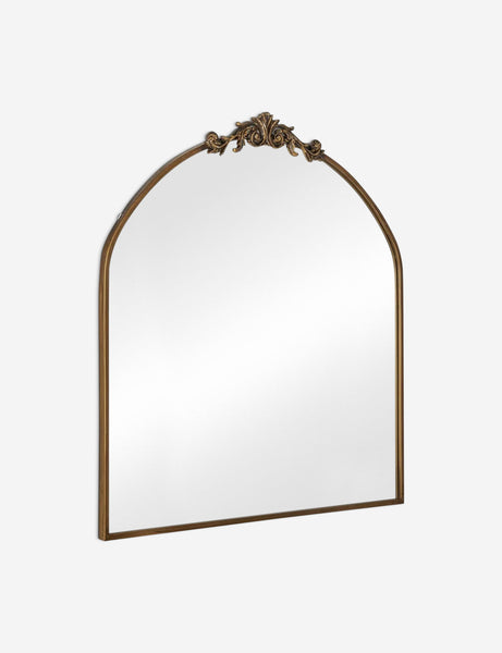 #color::gold | Angled view of the Tulca arched gold mirror with flat bottom edge and traditional scroll detailing.
