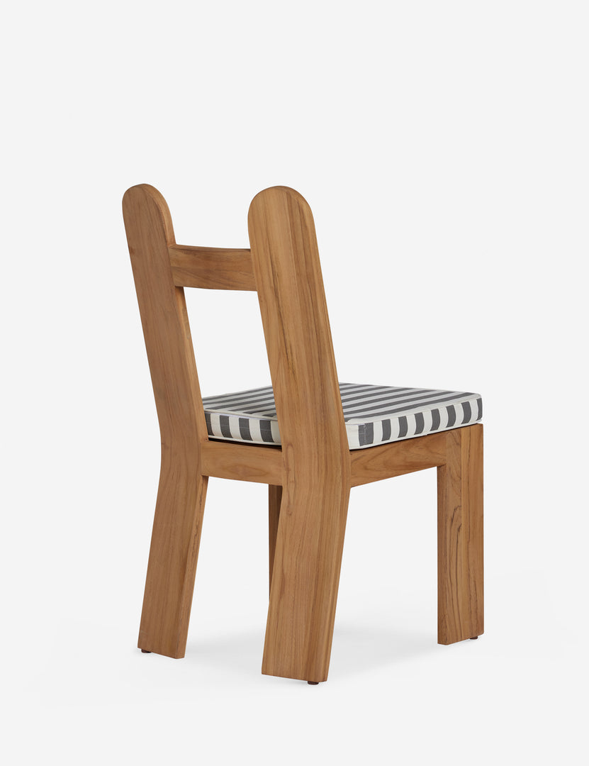 #color::natural-teak | Angled back view of the Abbot solid teak sculptural outdoor dining chair by Sarah Sherman Samuel.