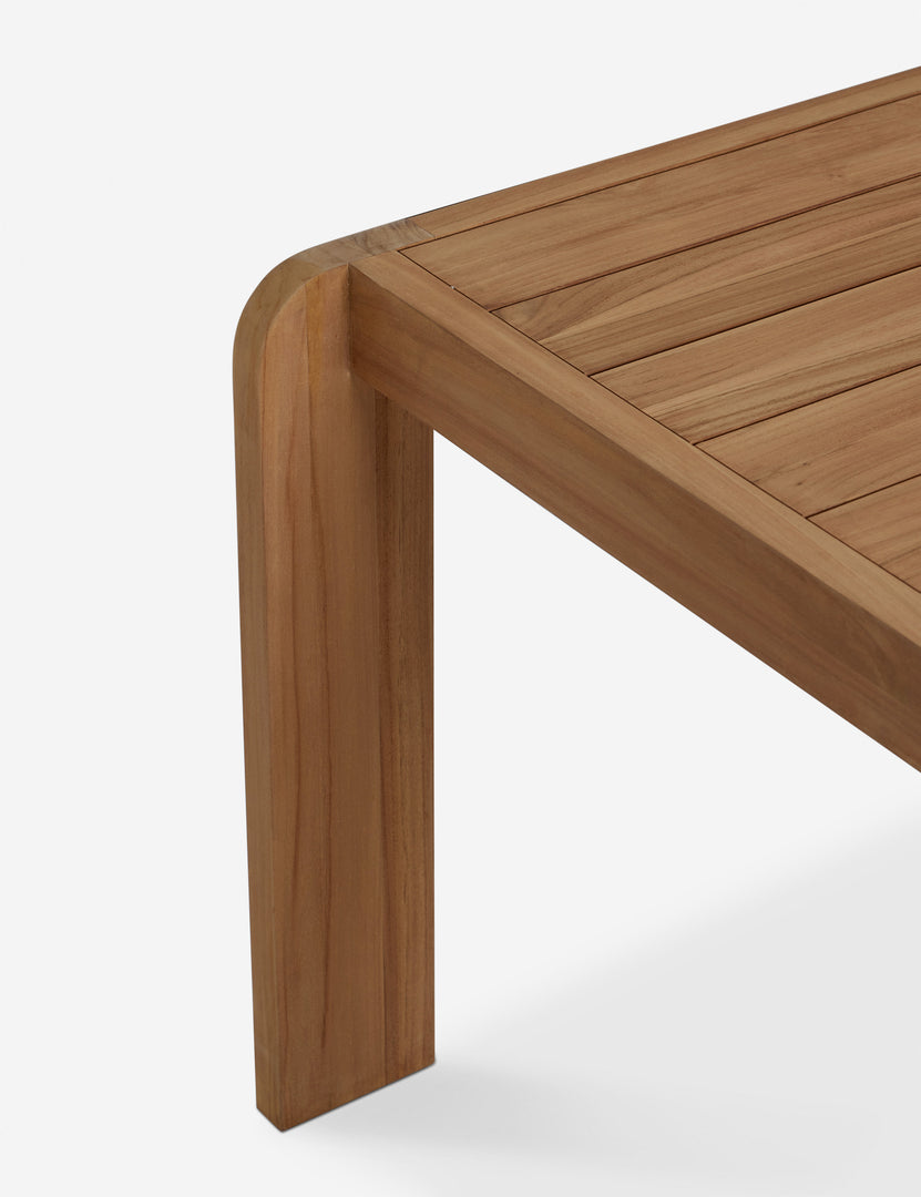 #color::natural-teak | Corner of the Abbot solid teak rectangular outdoor dining table by Sarah Sherman Samuel.