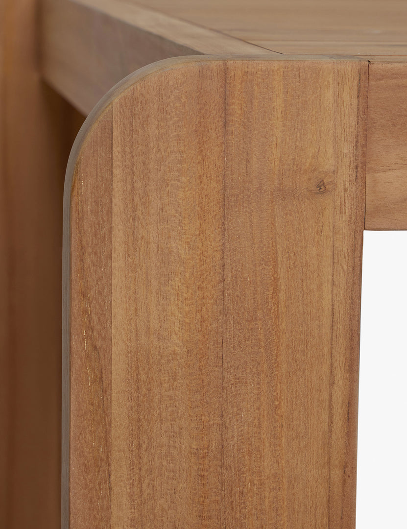 #color::natural-teak | Close up view of the Abbot solid teak rectangular outdoor dining table by Sarah Sherman Samuel.