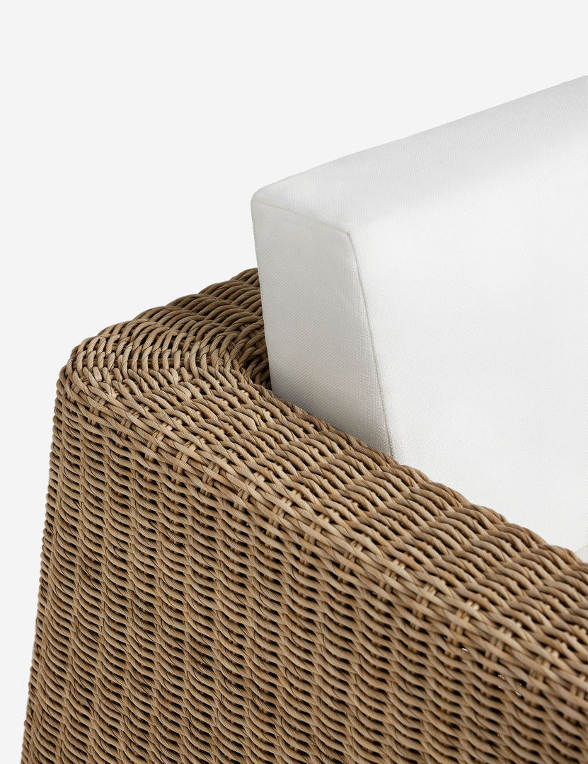 #color::natural | Close up of the arm of the Aisha wide arm modern wicker outdoor sofa.