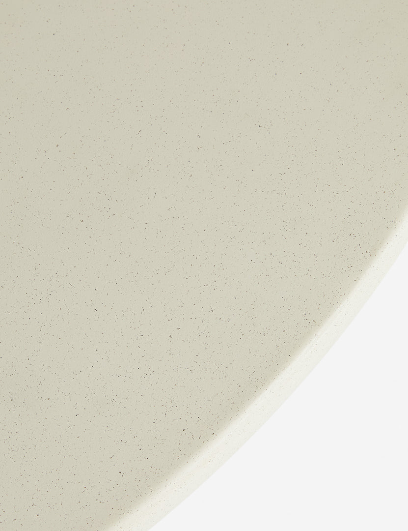 #color::ivory | Close up of the Amaya round sculptural cement coffee table.