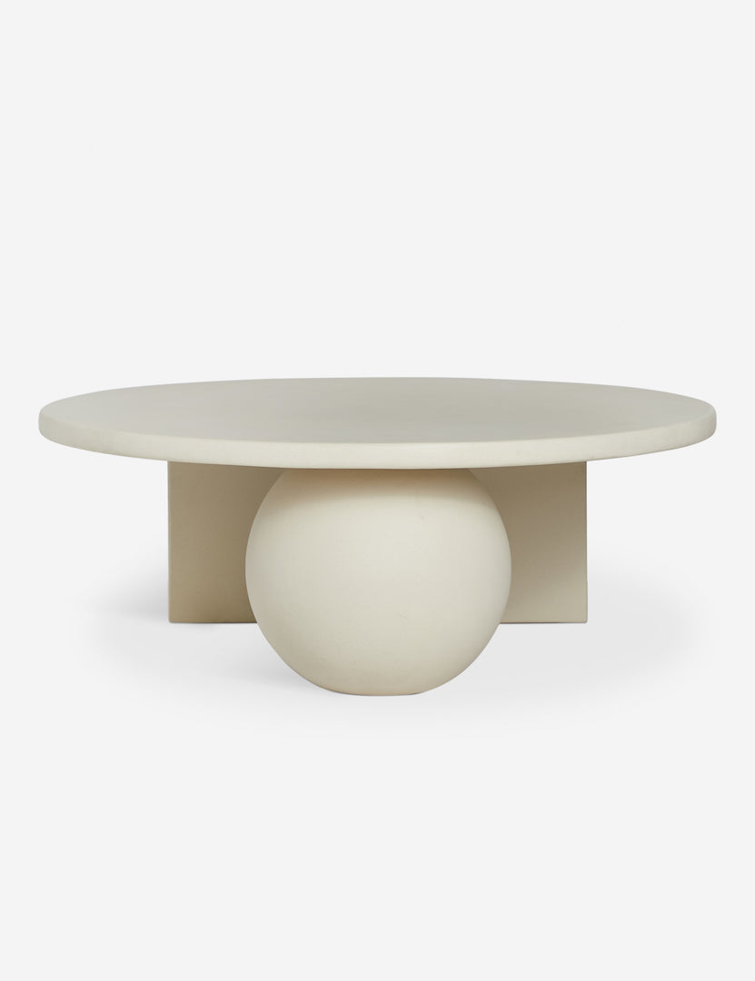#color::ivory | Front of the Amaya round sculptural cement coffee table.