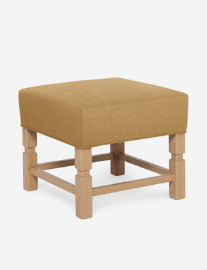 Angled view of the Ambleside Camel yellow linen ottoman