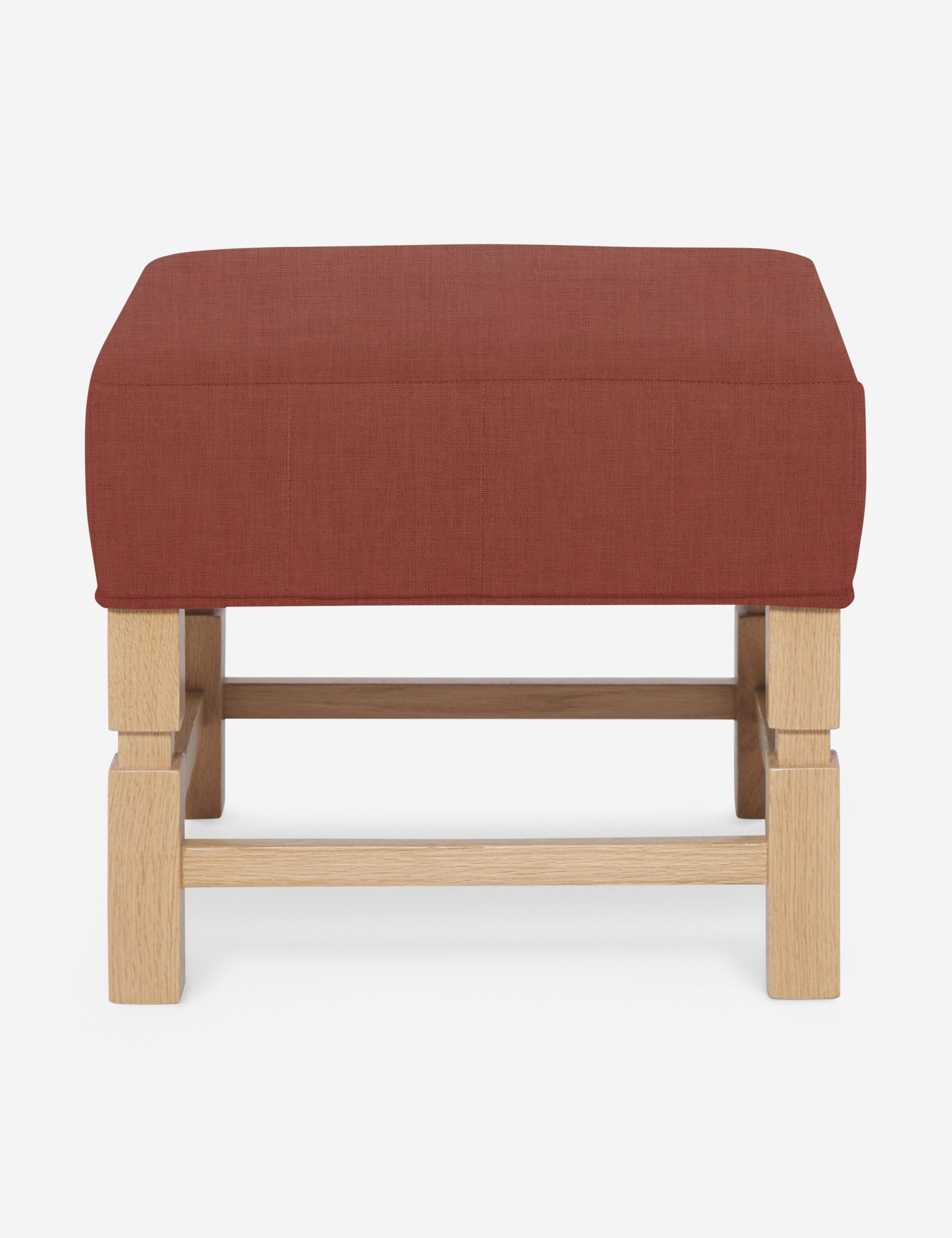 #color::terracotta-linen | Ambleside Terracotta linen upholstered ottoman by Ginny Macdonald with a carved frame and vertical channeling on the cushion