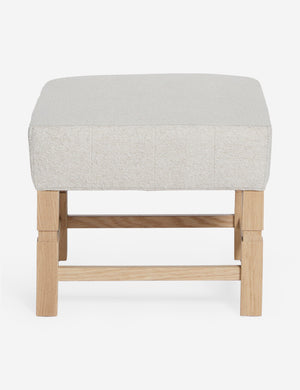 Ambleside Taupe Boucle upholstered ottoman by Ginny Macdonald with a carved frame and vertical channeling on the cushion