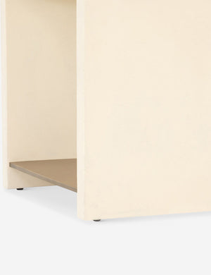 Close-up of the lacquered bottom shelf on the Aprilette Side Table