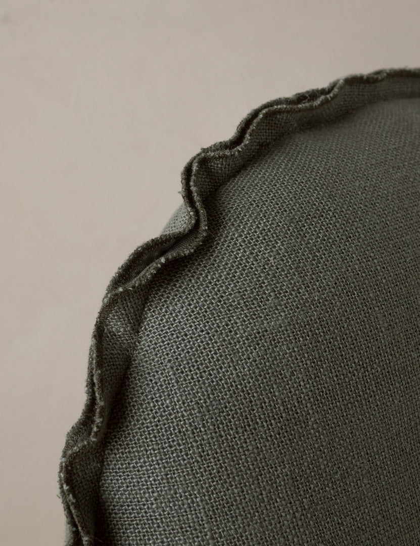 #color::conifer | Close up of the Arlo linen flange trim round pillow.