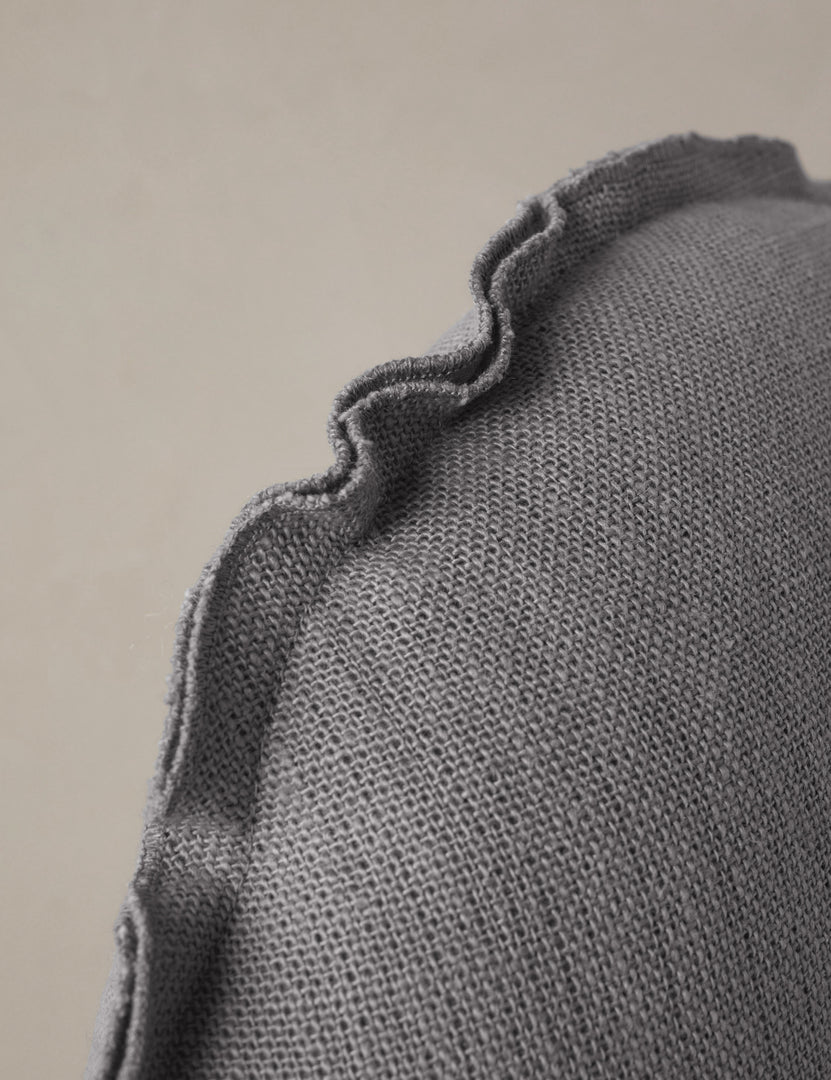 #color::dusty-blue | Close up of the Arlo linen flange trim round pillow.