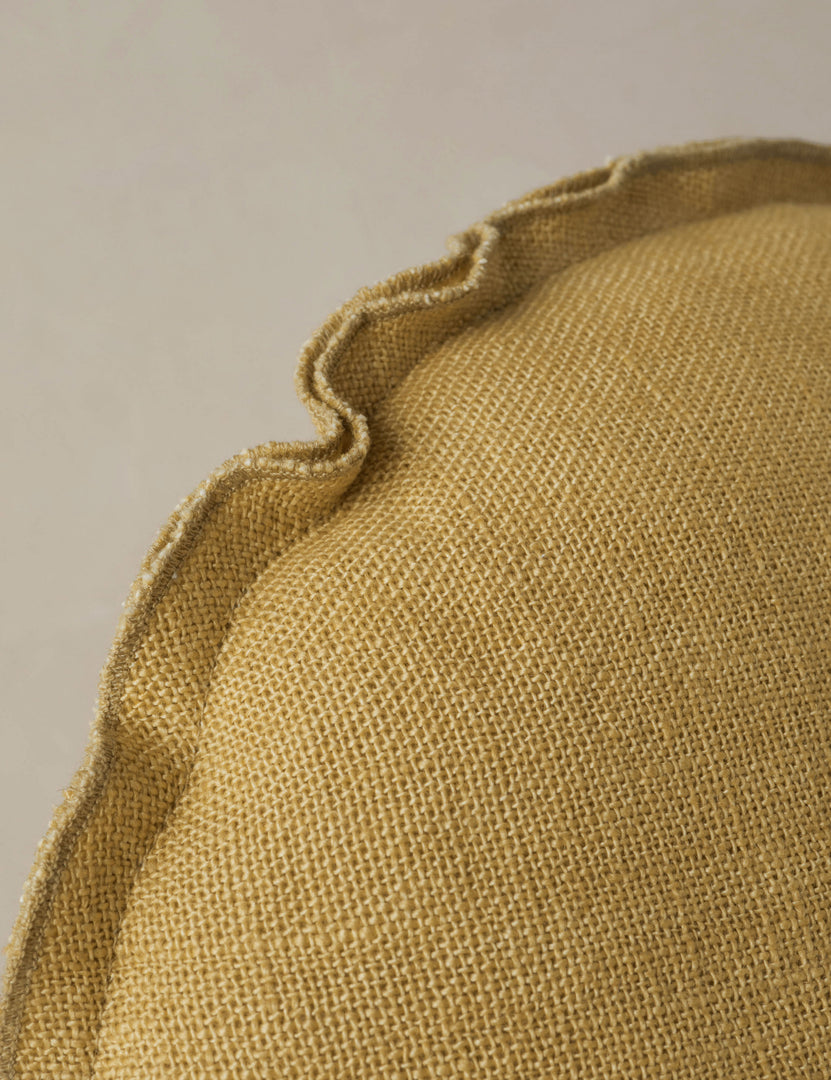 #color::marigold | Close up of the Arlo linen flange trim round pillow.