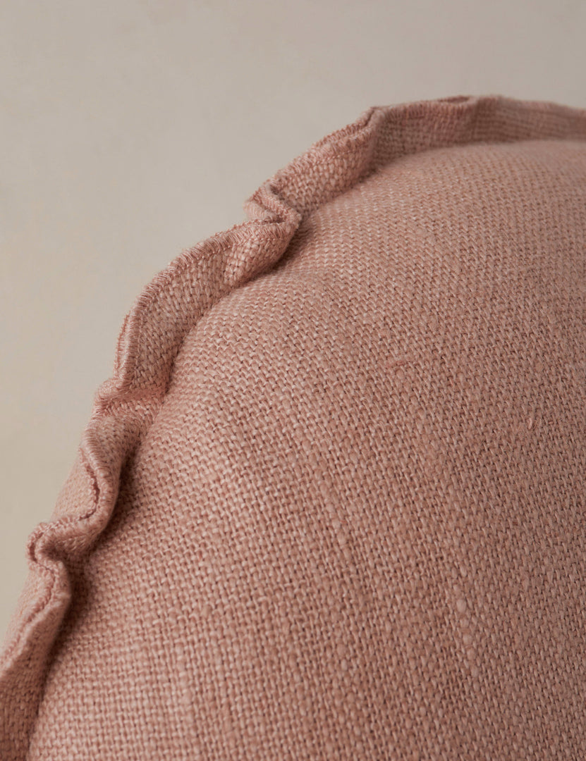 #color::terracotta | Close up of the Arlo linen flange trim round pillow.