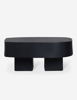 Side view of the Armas black monolithic round outdoor coffee table by Sarah Sherman Samuel.