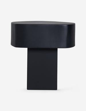 Side profile of the Armas black monolithic round outdoor side table by Sarah Sherman Samuel.