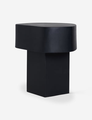 Armas black monolithic round outdoor side table by Sarah Sherman Samuel.
