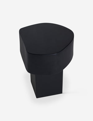 Angled overhead view of the Armas black monolithic round outdoor side table by Sarah Sherman Samuel.