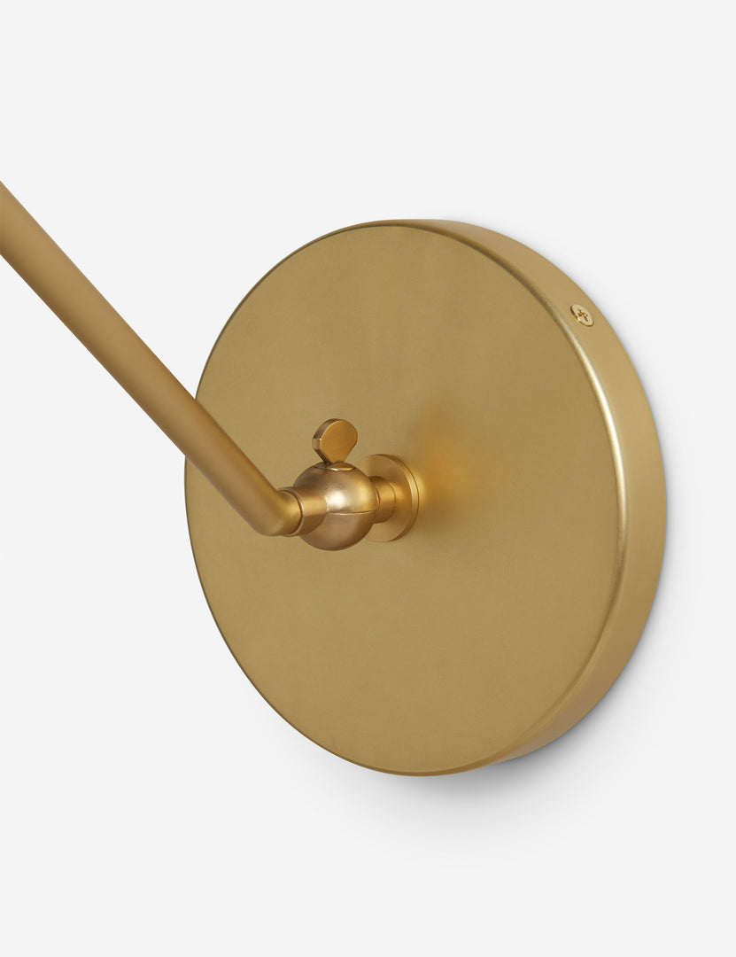 #color::brass | Close up of the mounting plate of the Arroyo Mixed-Material Adjustable Arm Sconce by Elan Byrd.