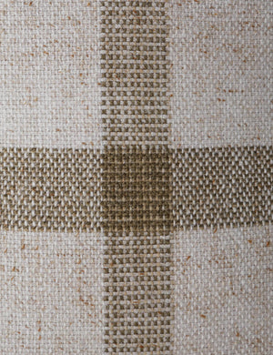 Close up of the Atif muted plaid outdoor throw pillow in moss.
