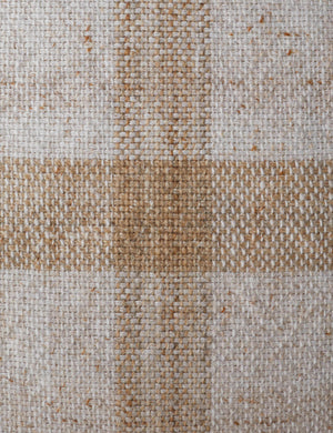 Close up of the Atif muted plaid outdoor throw pillow in natural.
