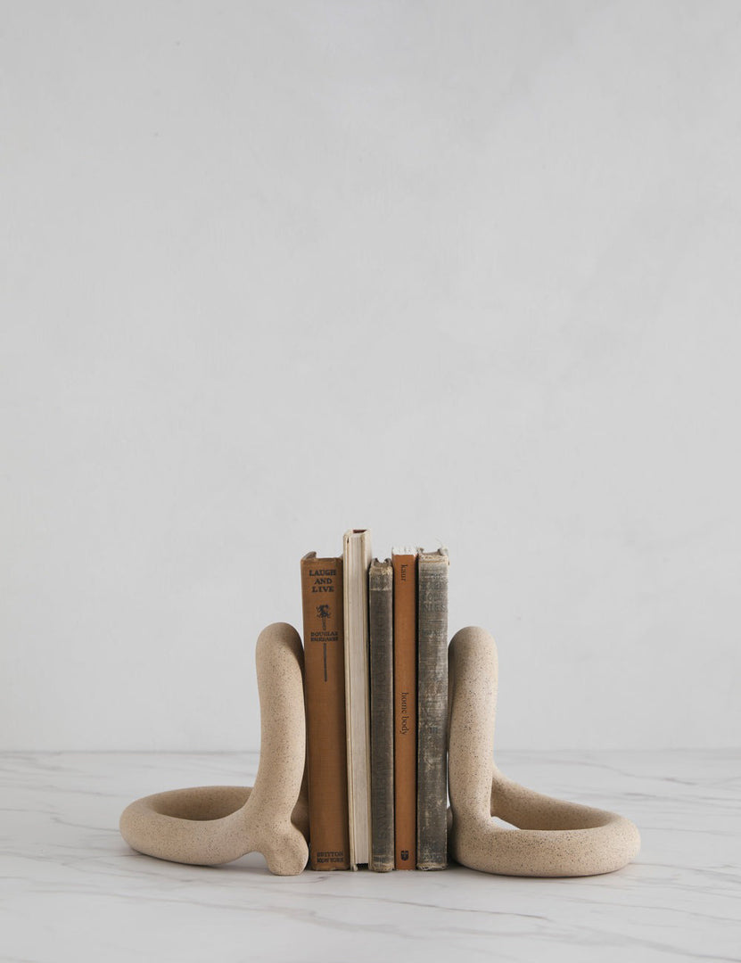 #color::sand | The Bacchus natural speckled ceramic bookends by sin with books in between them