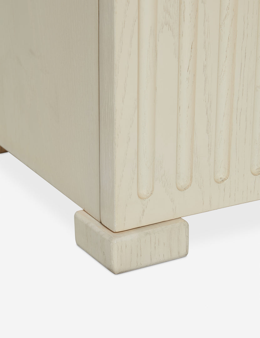 #color::light-oak | Close up of the bottom of the Beck grooved light wood nightstand.