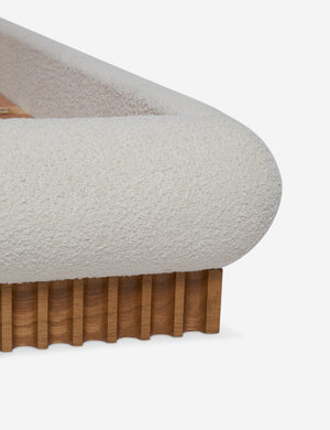 Corner of the Billow overstuffed boucle upholstered bed with wooden base