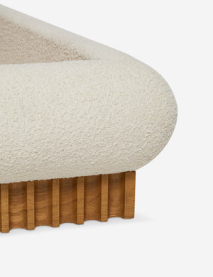 Corner of the Billow overstuffed boucle upholstered bed with wooden base