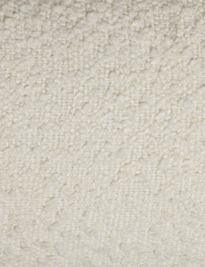 Close up view of the Billow overstuffed boucle upholstered bed with wooden base