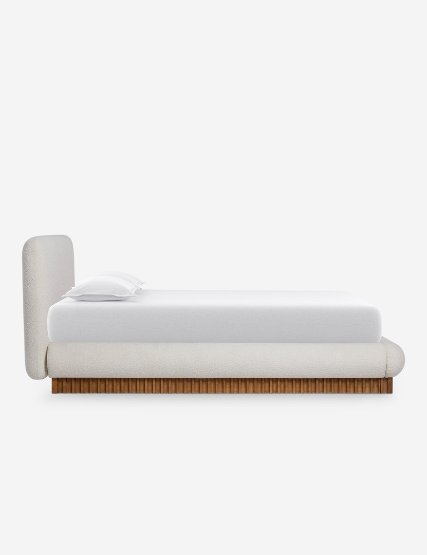 #color::ivory-boucle #size::queen #size::king | Side view of the Billow overstuffed boucle upholstered bed with wooden base
