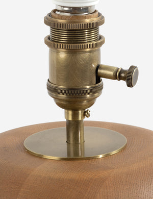 Hardware of the Linus sculptural natural oak base table lamp.