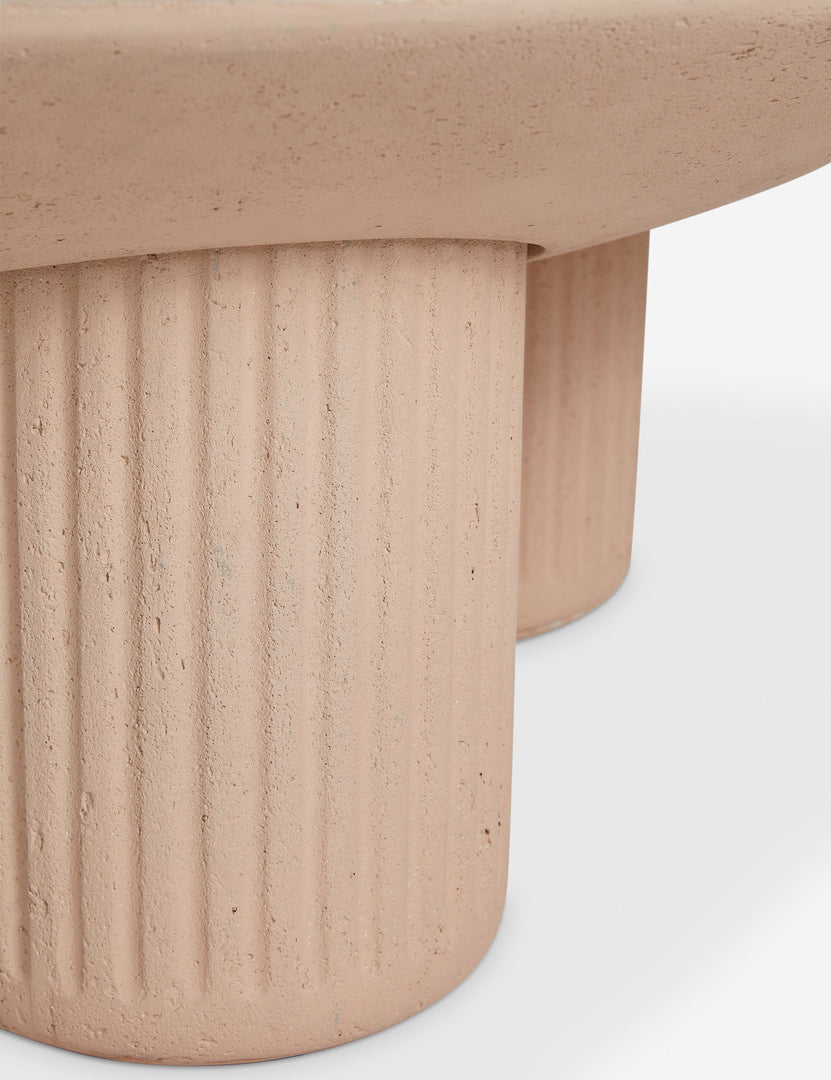 #color::terracotta | Close up of the base of the Carr modern round fluted base coffee table.
