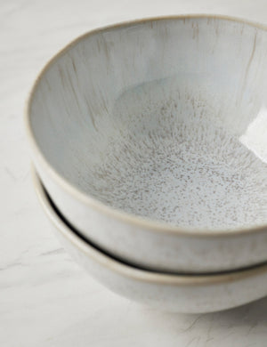 Detailed view of the speckles and striations on the inside of the Eivissa set of 6 shiny white glazed stoneware cereal bowls by Casafina